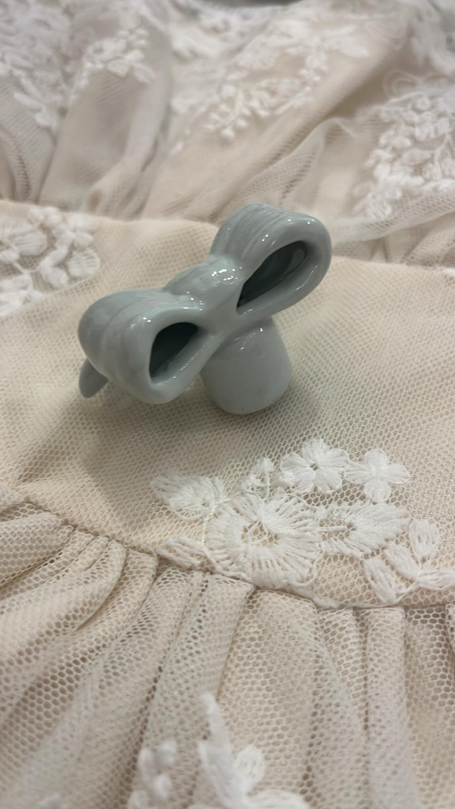 pomello decorativo in porcellana a forma di fiocco 5x5x3cm