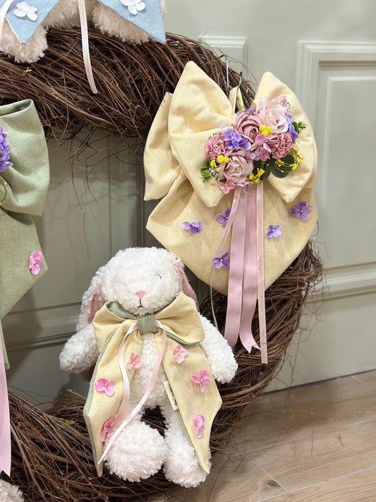 Coniglietto pupazzo con fiocco giallo