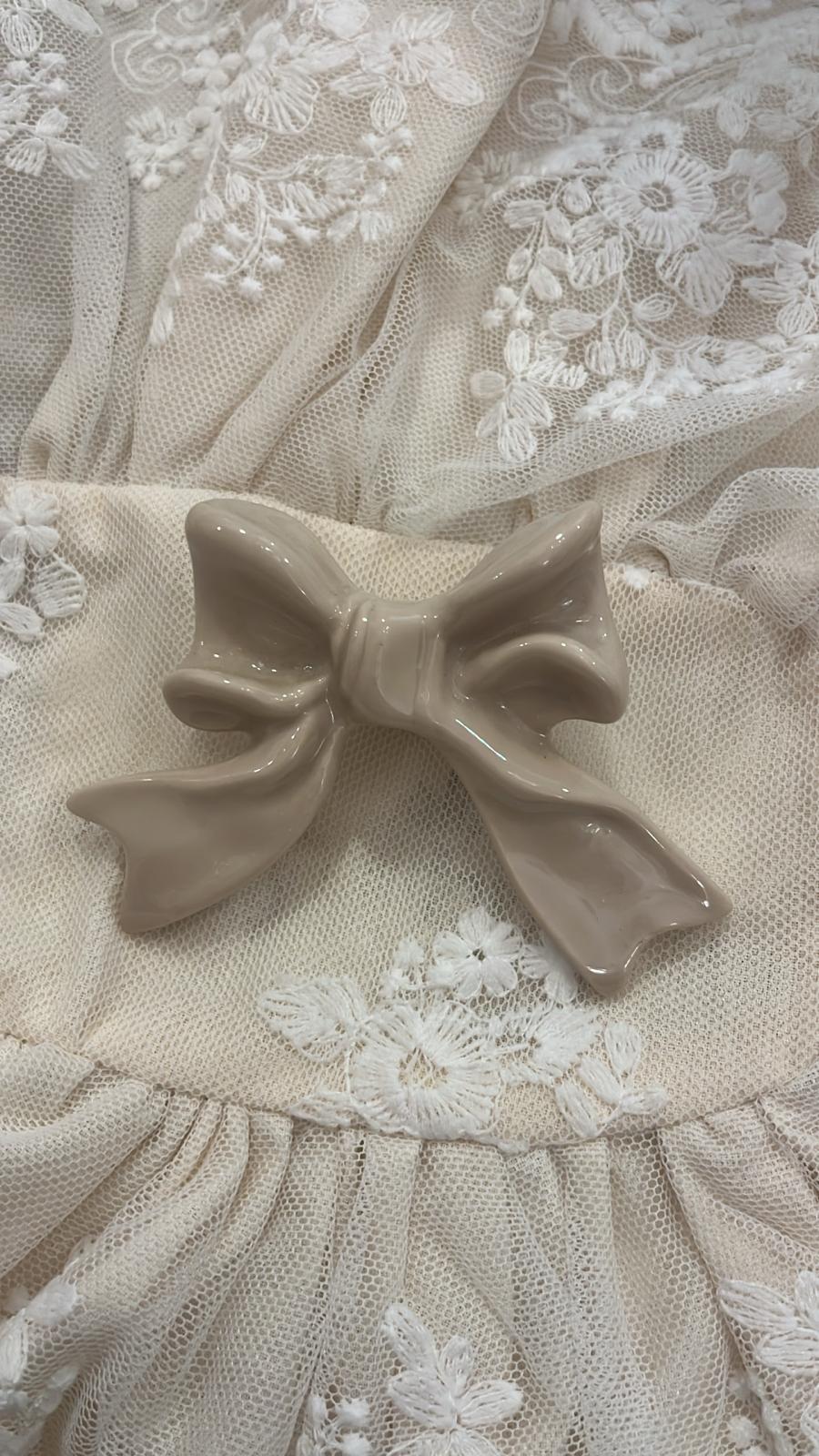 pomello decorativo in porcellana a forma di fiocco 6x6x3cm